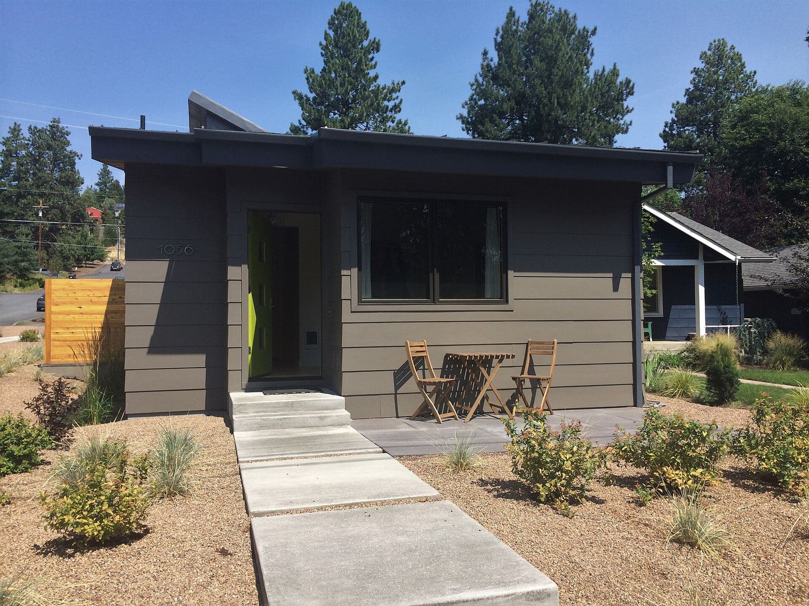 A small detached secondary dwelling unit beside a house in Oregon