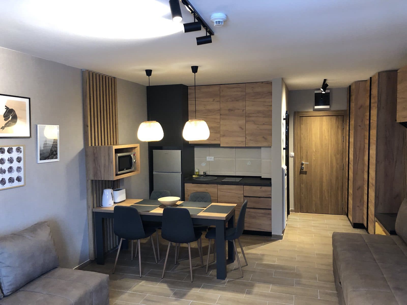 A compact apartment kitchen with a dining table